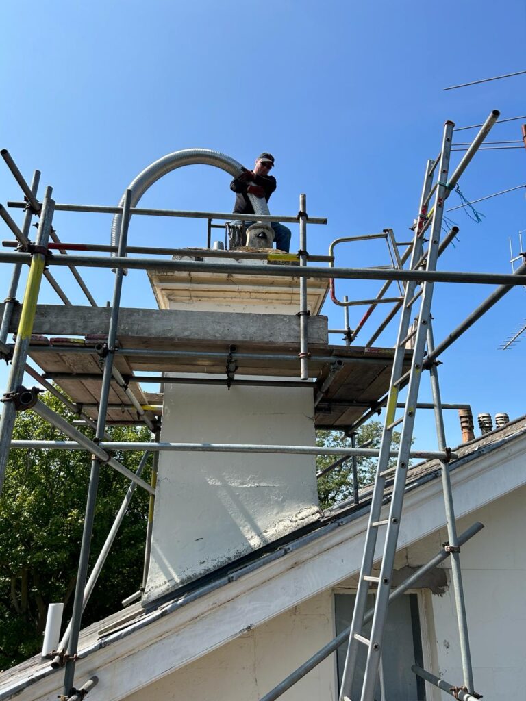 Chimney Flue liner fitting with scaffolding